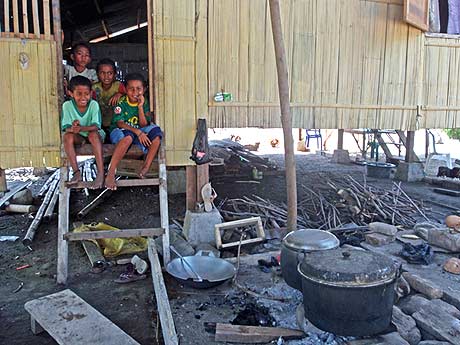 House on stilts with children, Maurole